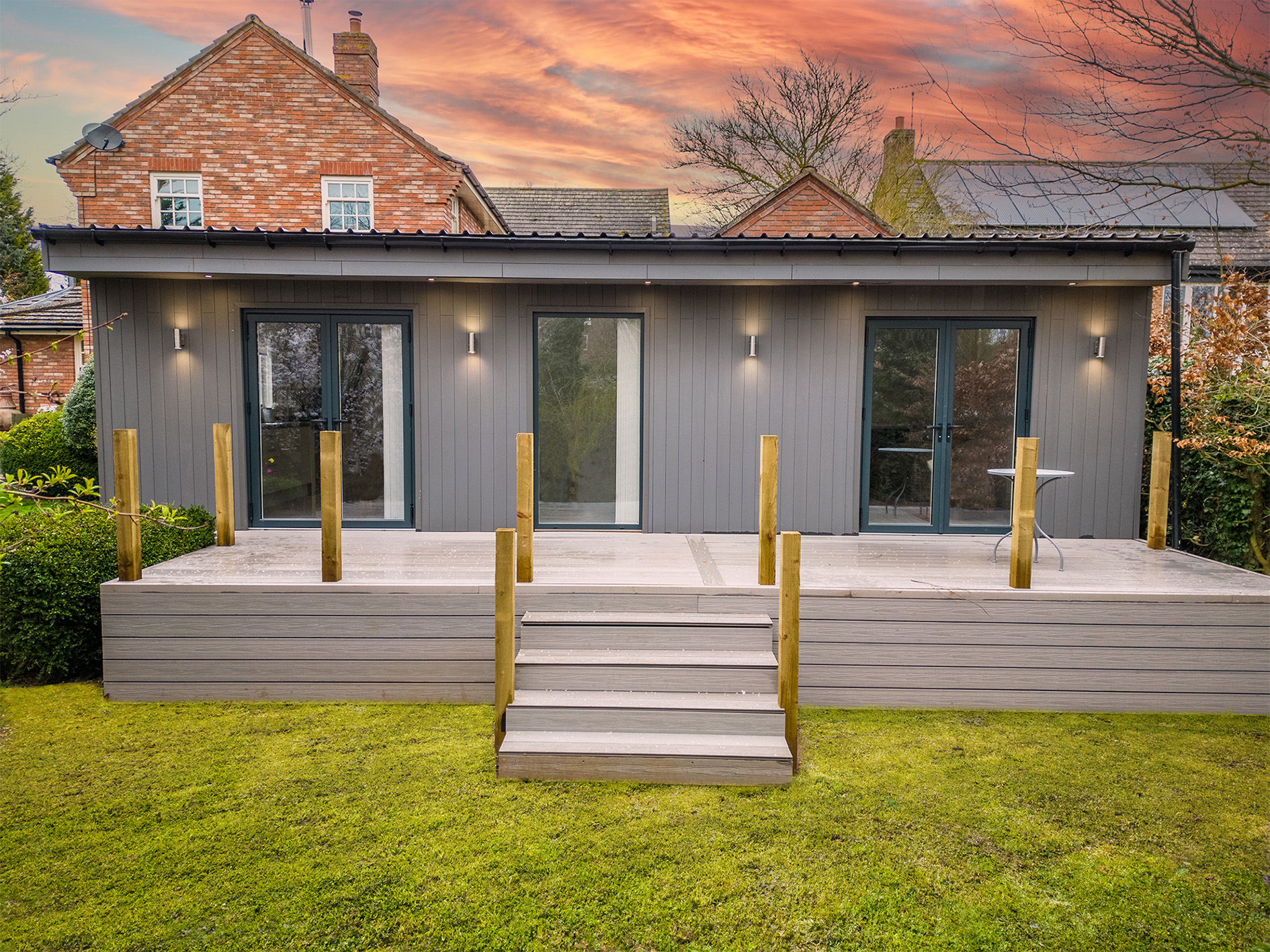 Exterior grey MALA Annexe frontage with decking 
